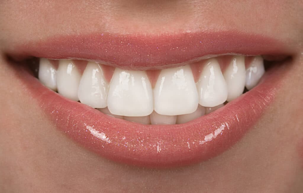 Extreme close-up of a clean, healthy human smile